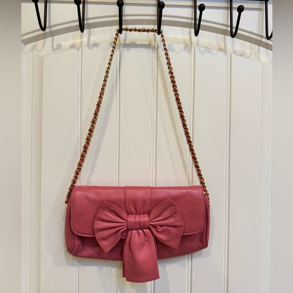 Paradox Pink Leather Bow Shoulder Purse. 10” by 6” by 0.5” with strap drop 13”